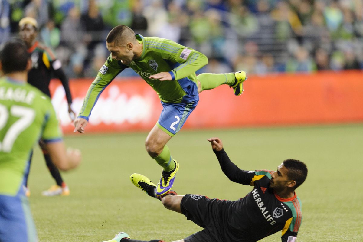 Clint Dempsey getting tackled by one of our newest defenders; Sean Franklin.