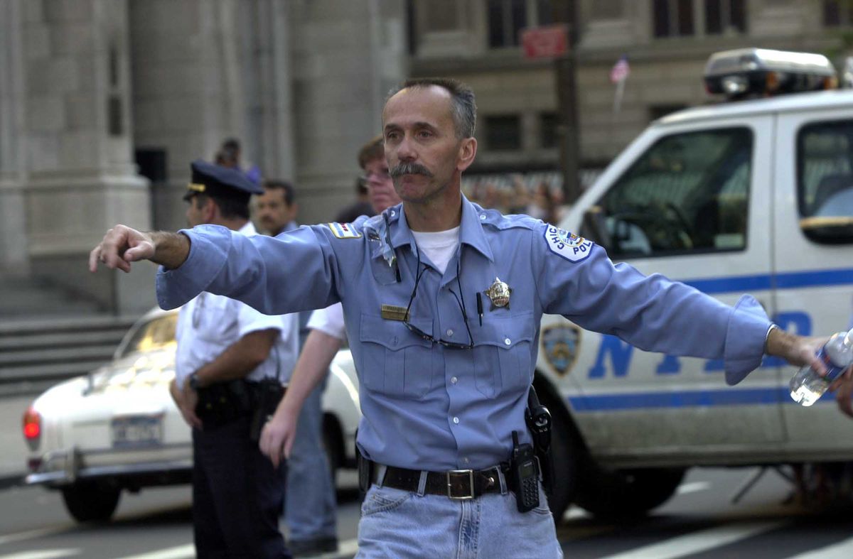 Chicago police Officer John Paskey directs traffic outside St. Patrick’s Cathedral in New York on Sept. 17, 2001.