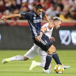 Real Salt Lake midfielder Albert Rusnák (11) falls as he battles Los Angeles Galaxy midfielder Sebastian Lletget (17) for the ball as Real Salt Lake and the LA Galaxy play at Rio Tinto Stadium in Sandy on Wednesday, Sept. 25, 2019.