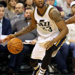 Utah Jazz forward Chris Johnson (23) dribbles during a basketball game against the Miami Heat at the Vivant Smart Home Arena in Salt Lake City on Saturday, Jan. 9, 2016.