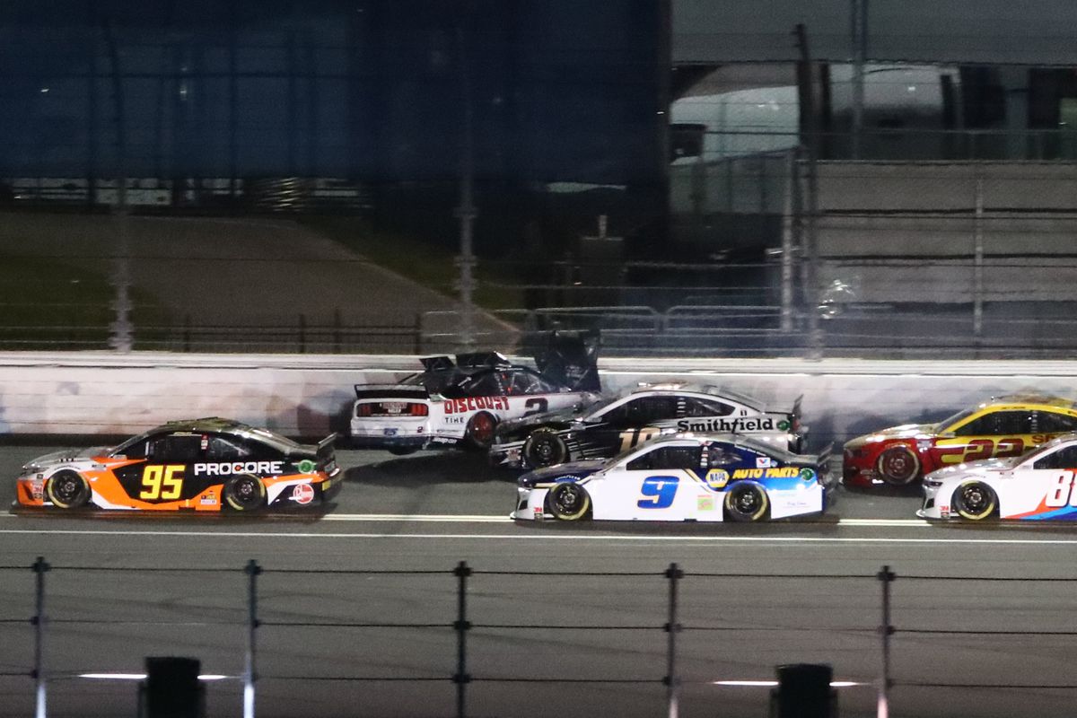 NASCAR Cup Series drivers Christopher Bell, Chase Elliott go low as Brad Keselowski crashes after contact from Aric Almirola during the Daytona 500 at Daytona International Speedway. The race is being run on a Monday after raining out Sunday.&nbsp;