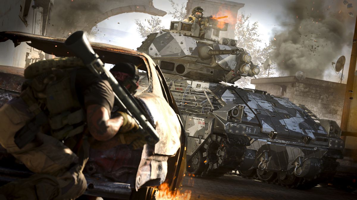 a player with a rocket launcher hides behind a wrecked car while another rides a tank in a screenshot from Call of Duty: Modern Warfare (2019).