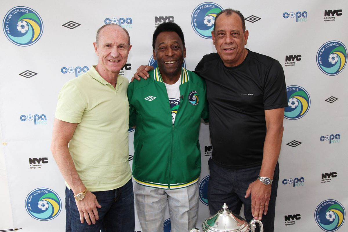 Dennis Tueart and Carlos Alberto (who provided foreword for the book) flank Pele. 