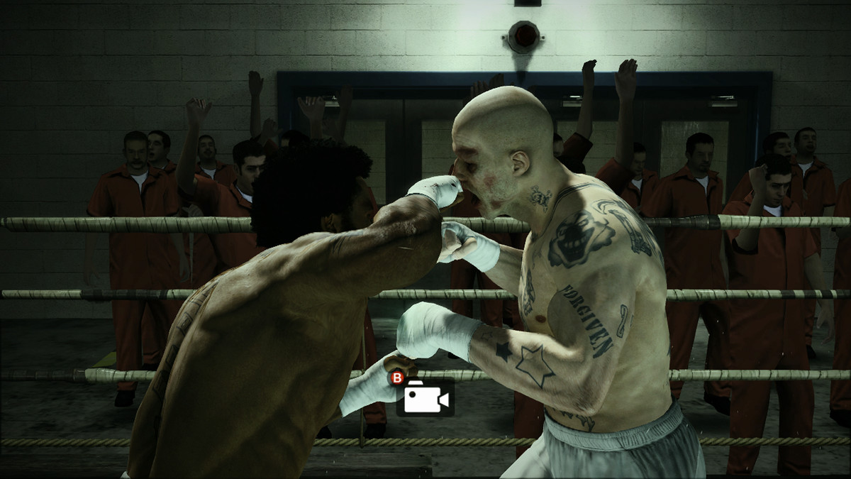 a black boxer hits a skinhead boxer with a right hook in a ring at a prison in Fight Night Champion