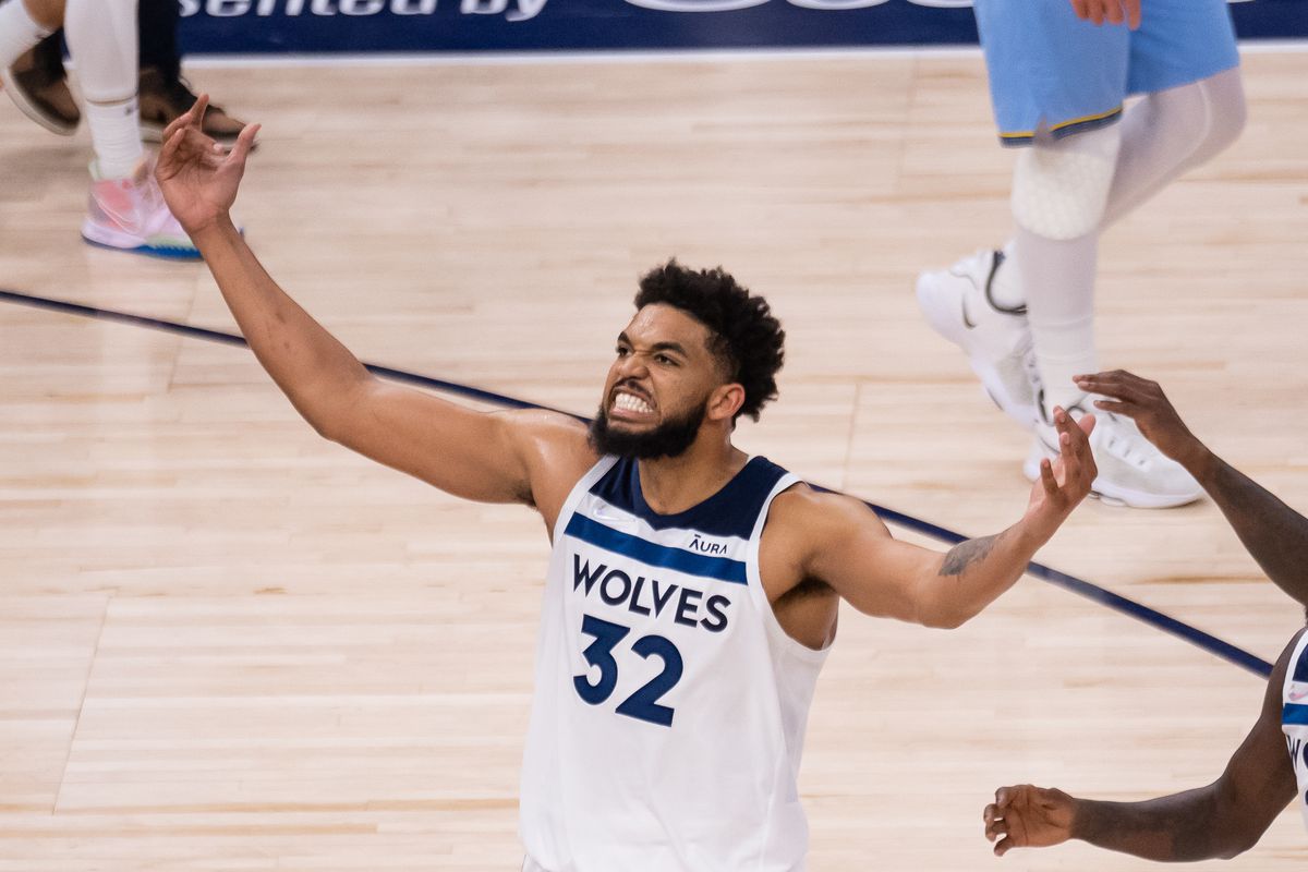 Minnesota Timberwolves center Karl-Anthony Towns (32) celebrates against the Memphis Grizzlies in the third quarter during game four of the first round for the 2022 NBA playoffs at Target Center.