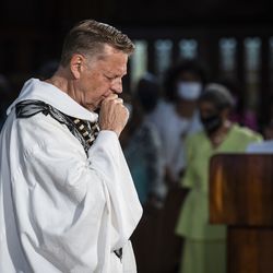 Father Michael Pfleger gets emotional as he celebrates Mass for the first time since January after he was reinstated as senior pastor of the Faith Community of Saint Sabina in Auburn Gresham, Sunday, June 6, 2021. The Archdiocese of Chicago cleared Pfleger to return to the South Side church after an internal probe into decades-old allegations of sexual abuse against minors.