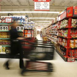 A shopper pushes a cart through the Sagara International Grocery in Columbus, Ohio, on Thursday, Feb. 22, 2018. Immigrants, including refugees, are changing the landscape of Columbus, which, among other things, has the largest Bhutanese population in the United States. The Columbus area also is home to a large concentration of Somali refugees.