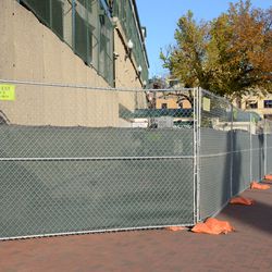 3:32 p.m. Construction fences along the Addison Street side - 