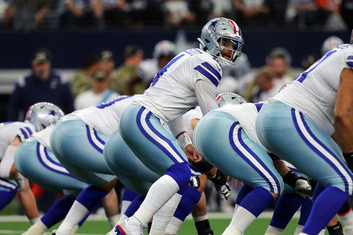 Dak Prescott #4 of the Dallas Cowboys gets ready to recieve the snap durign the game against the Denver Broncos at AT&amp;T Stadium on November 07, 2021 in Arlington, Texas.