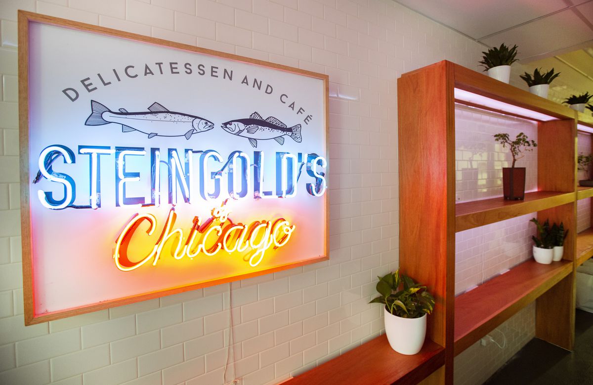 A neon sign reads “Steingold’s Chicago Delicatessen and Cafe” 