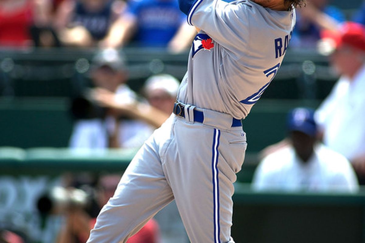 ARLINGTON, TX - MAY 26:  Colby Rasmus #28 of the Toronto Blue Jays hits a homerun against the Texas Rangers at Rangers Ballpark in Arlington on May 26, 2012 in Arlington, Texas.  (Photo by Cooper Neill/Getty Images)
