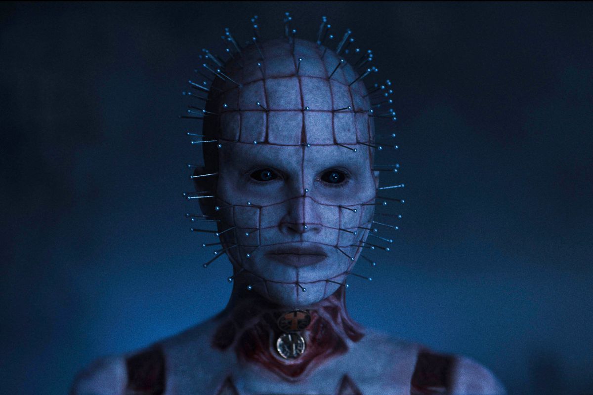 Jamie Clayton has pins in her head and a flayed neck in full Pinhead get-up.
