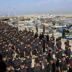 In this Dec. 4, 2014 file photo, members of the Palestinian Hamas security forces participate in their graduation ceremony at the fisherman's port in Gaza City, northern Gaza Strip. An Egyptian court declared Hamas a "terrorist organization" Saturday, Feb. 28, 2015, further isolating the rulers of the Gaza Strip who once found a warm welcome under the country's past Islamist government. The ruling described Hamas as targeting both civilians and security forces inside Egypt's restive Sinai Peninsula and aiming to harm the country.