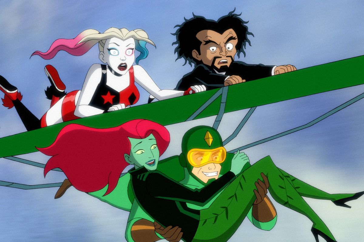 kite man heroically gliding through the air, holding poison ivy, with Harley and Doctor Psycho clinging to his glider
