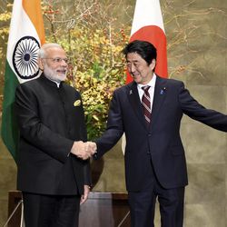 Indian Prime Minister Narendra Modi, left, is welcomed by his Japanese counterpart Shinzo Abe upon his arrival for their meeting at Abe's official residence in Tokyo, Friday, Nov. 11, 2016. Modi is visiting Japan on a three-day visit. 
