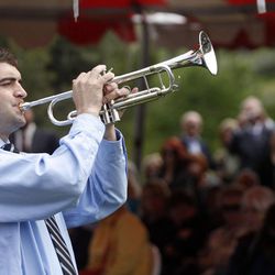 Parker Hill plays a trumpet medley during a memorial service to honor 142 people who gave their bodies to science and education at the University of Utah last year at the Salt Lake City Cemetery in Salt Lake City on Friday, May 27, 2011. 
