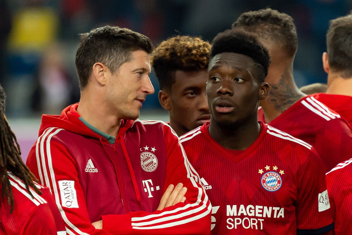 DUESSELDORF, GERMANY - JANUARY 13: Robert Lewandowski of Bayern Muenchen and Alphonso Davies of Bayern Muenchen after winning the Telekom Cup 2019 Final between FC Bayern Muenchen and Borussia Moenchengladbach at Merkur Spiel-Arena on January 13, 2019 in Duesseldorf, Germany.