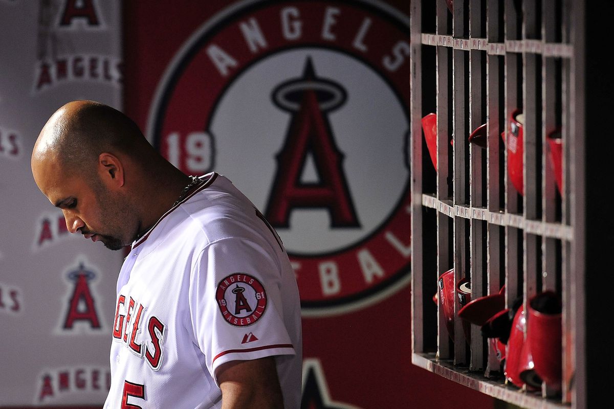 July 28, 2012; Anaheim, CA, USA; Los Angeles Angels first baseman Albert Pujols (5) before the eighth inning against the Tampa Bay Rays at Angel Stadium. Mandatory Credit: Gary A. Vasquez-US PRESSWIRE