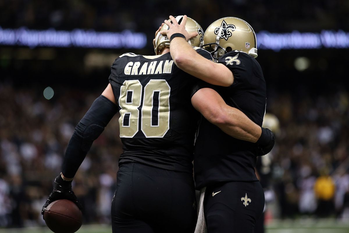 NEW ORLEANS, LA - New Orleans Saints quarterback Drew Brees (9) and tight end Jimmy Graham (80) celebrate a fourth quarter touchdown against the Atlanta Falcons defense at the Mercedes-Benz Superdome.