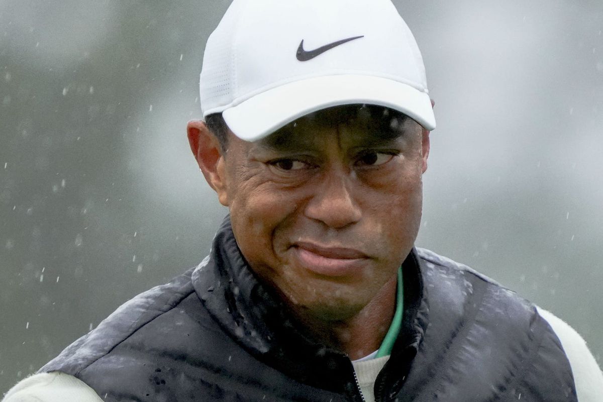 Tiger Woods reacts after putting on the 18th green during the second round of The Masters golf tournament.
