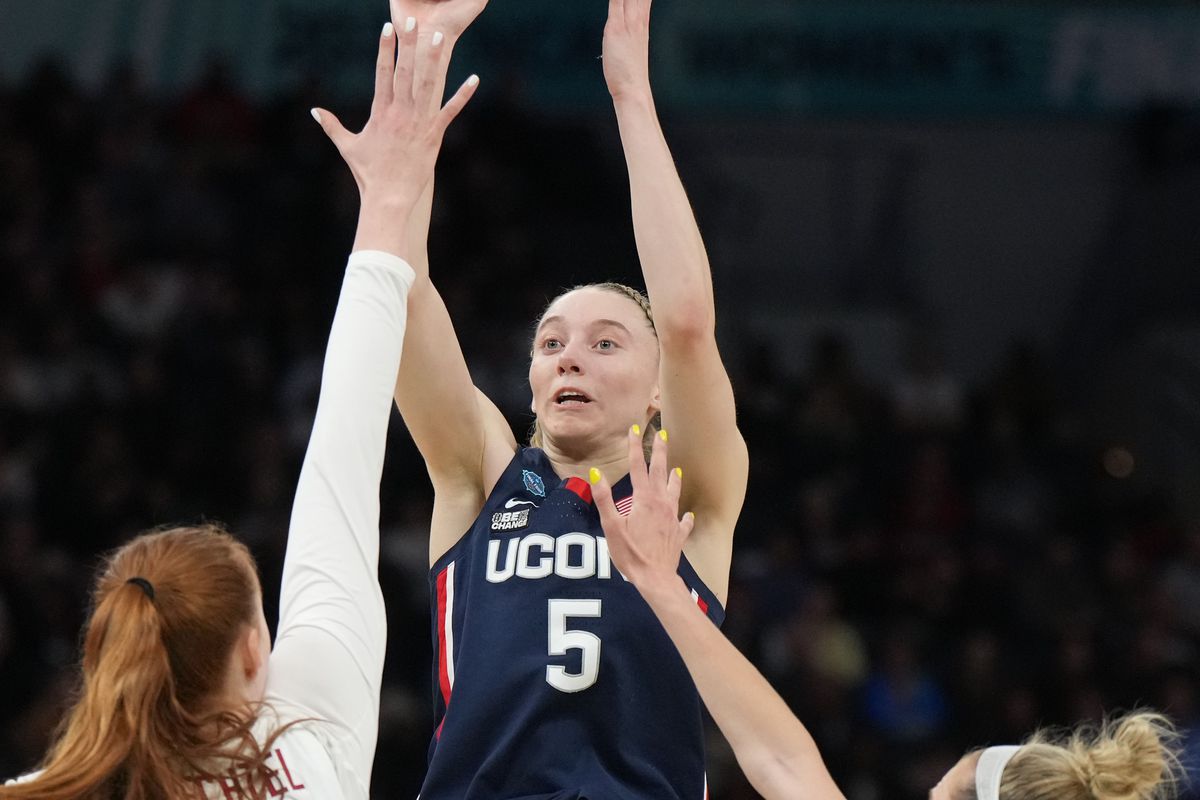 UConn Huskies guard Paige Bueckers shoots the ball over Stanford Cardinal forward Ashten Prechtel and Stanford Cardinal guard Lexie Hull during the first half in the Final Four semifinals of the women’s college basketball NCAA Tournament at Target Center.&nbsp;