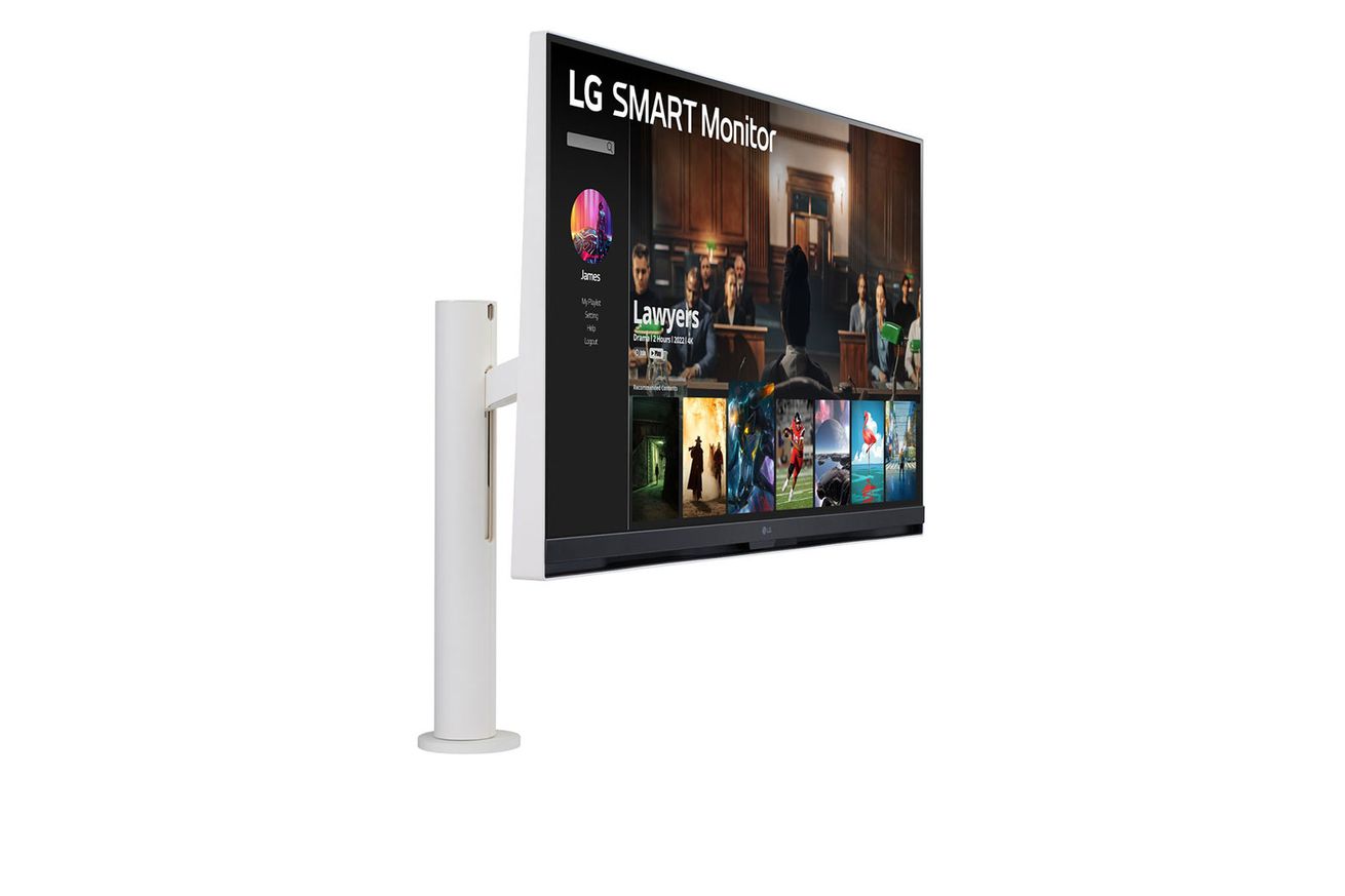 The LG 4K Smart Monitor has a white cylindrical stand that has a slit running up for the height adjustable mechanics, and the monitor attached is also white on the outside but the bezel is black and gray, a couple slits on the bottom of the bezel houses speakers.