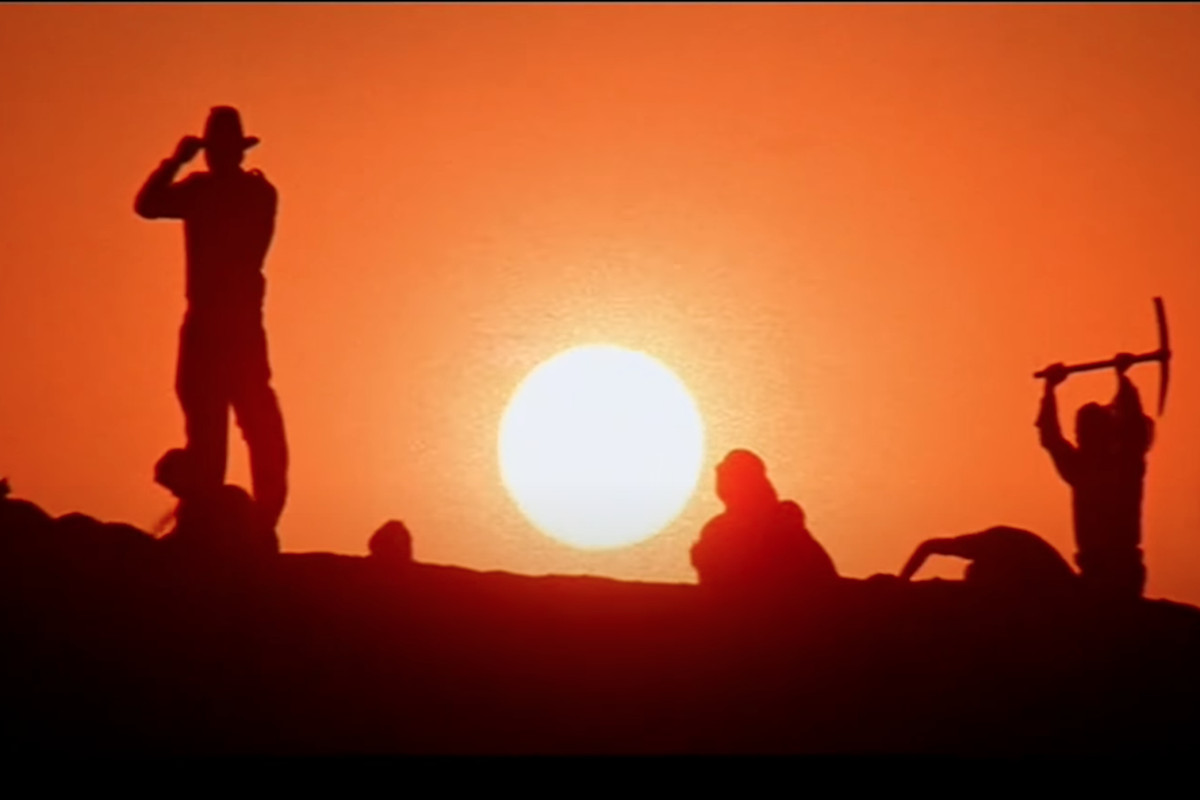 Indiana Jones supervises the dig, at sundown, of the Well of the Souls, where he will find the lost Ark of the Covenant