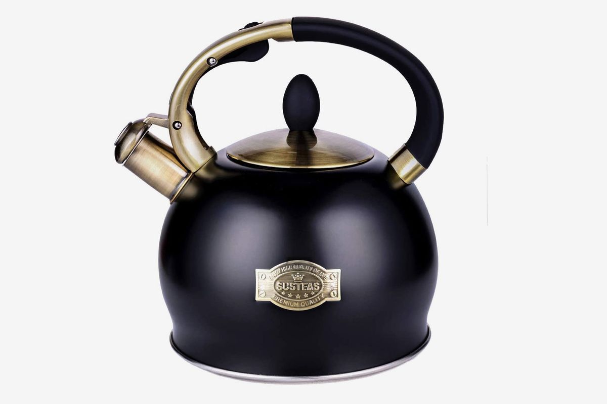 A black kettle with golden hardware
