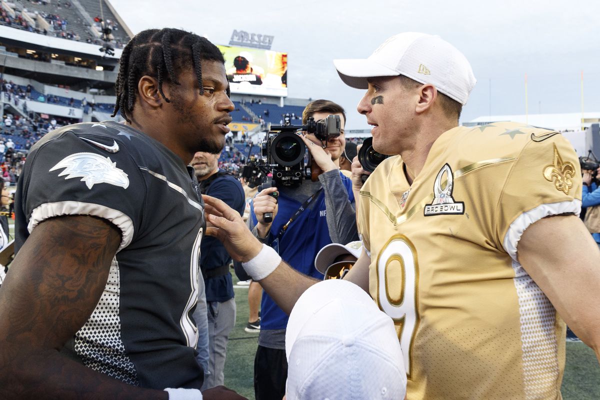 Quarterback Lamar Jackson #8 of the Baltimore Ravens from the AFC Team talk with Quarterback Drew Brees #9 of the New Orleans Saints from the NFC Team after the NFL Pro Bowl Game at Camping World Stadium on January 26, 2020 in Orlando, Florida. The AFC defeated the NFC 38 to 33.