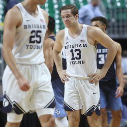 Brigham Young Cougars forward Gavin Baxter (25) and Brigham Young Cougars guard Taylor Maughan (13) and the rest of the BYU Cougars walk off the court after falling to the San Diego Toreros in WCC tournament action at the Orleans Arena in Las Vegas on Saturday, March 9, 2019. San Diego won 80-57.