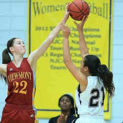 Viewmont's Megan Carr blocks a shot by Riverton's Kiana Tai during play Wednesday, Feb. 18, 2015, in 5A State quarterfinal action at Salt Lake Community College in Taylorsville.