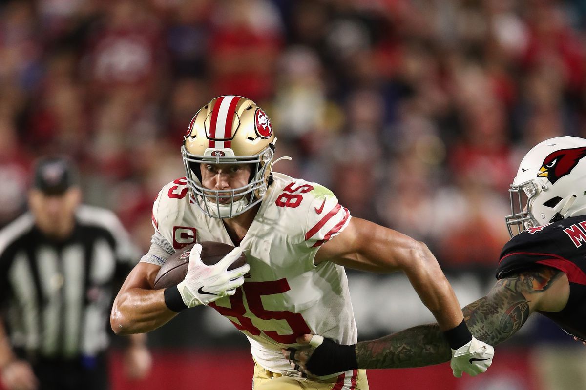 Tight end George Kittle of the San Francisco 49ers runs with the football against the Arizona Cardinals during the first half of the NFL game at State Farm Stadium on October 31, 2019 in Glendale, Arizona.