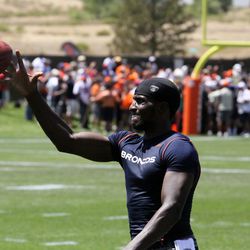 Denver Broncos wide receiver Gerrell Robinson practices one-handed catches after practice Friday August 2, 2013.