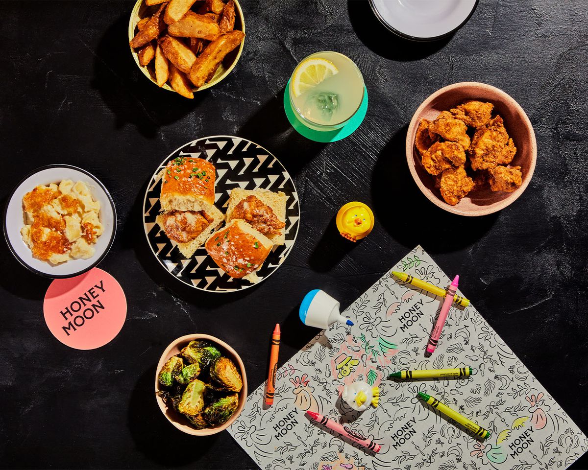 A sampling of kid’s meal options with Crayons and coloring paper.