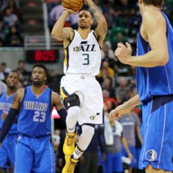 Utah Jazz guard George Hill (3) hits a three pointer against Dallas to end the first half during NBA basketball in Salt Lake City on Wednesday, Nov. 2, 2016. 
