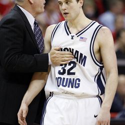 Brigham Young guard Jimmer Fredette heads to the bench during a timeout as he gets encouragement from Brigham Young head coach Dave Rose near the end of the game as BYU plays against UNLV in the Mountain West Conference basketball Championship Tournament at the Thomas & Mack Center in Las Vegas, Nevada, Friday, March 12, 2010.