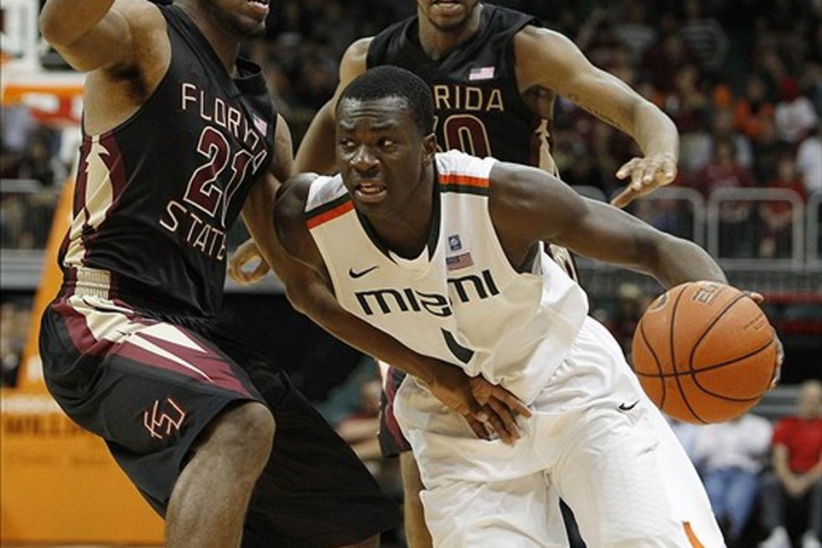 Feb 26, 2012; Coral Gables, FL, USA;  Miami Hurricanes guard Durand Scott (1) drives to the basket against Florida State Seminoles guard Michael Snaer (21) in the second half at the BankUnited Center. Mandatory Credit: Robert Mayer-US PRESSWIRE