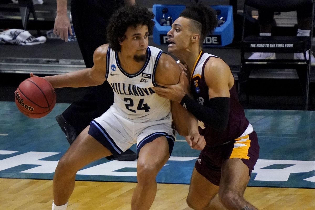 Winthrop Eagles forward Kelton Talford guards Villanova Wildcats forward Jeremiah Robinson-Earl during the first round of the 2021 NCAA Tournament on Tuesday, March 19, 2019, at Indiana Farmers Coliseum in Indianapolis, Ind.
