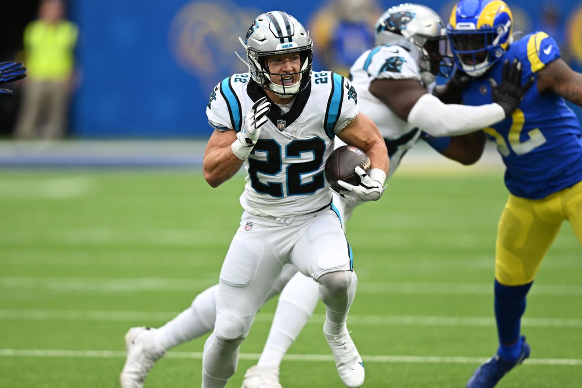 Christian McCaffrey #22 of the Carolina Panthers runs the ball while playing the Los Angeles Rams at SoFi Stadium on October 16, 2022 in Inglewood, California.