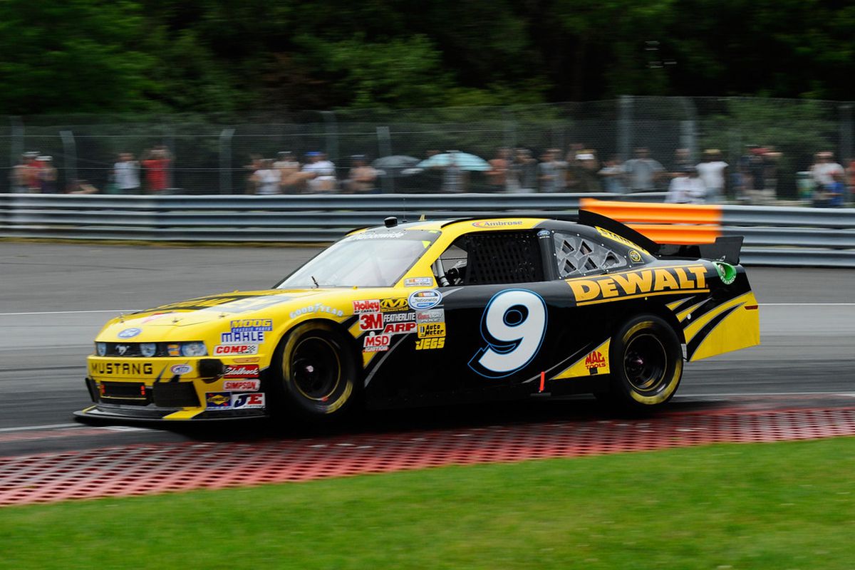 Marcos Ambrose drives the No. 9 Ford during the NASCAR Nationwide Series NAPA Auto Parts 200 at Circuit Gilles Villeneuve.