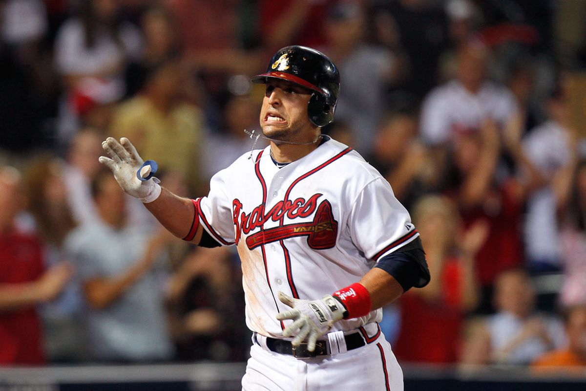 ATLANTA, GA - JUNE 01:  Martin Prado #14 of the Atlanta Braves reacts in the sixth inning after hitting a solo homer against the San Diego Padres at Turner Field on June 1, 2011 in Atlanta, Georgia.  (Photo by Kevin C. Cox/Getty Images)