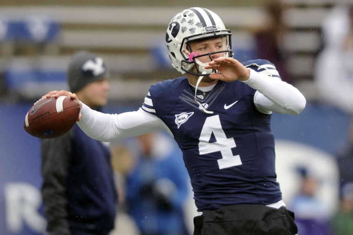 Brigham Young Cougars quarterback Taysom Hill (4) warms up prior to the start of the Idaho State game at LaVell Edwards Stadium on Saturday, November 16, 2013.