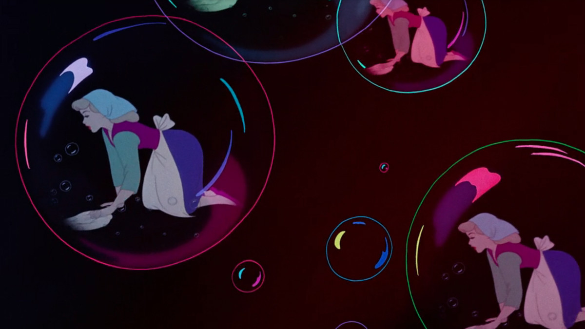 Cinderella as reflected in three soap bubbles, her colors all a little weird