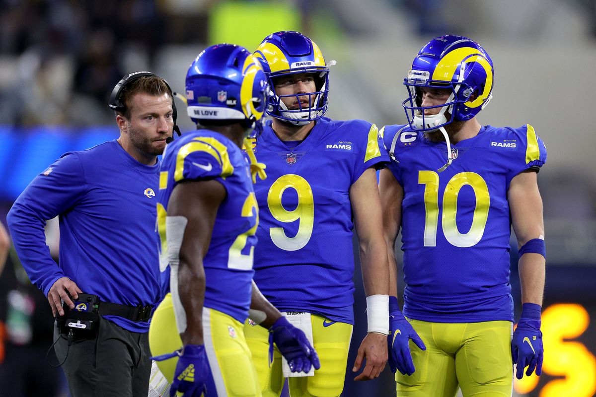 Matthew Stafford #9 of the Los Angeles Rams reacts with teammates Cooper Kupp #10, Sony Michel #25 and Head Coach Sean McVay in the second quarter of the game against the Arizona Cardinals in the NFC Wild Card Playoff game at SoFi Stadium on January 17, 2022 in Inglewood, California.