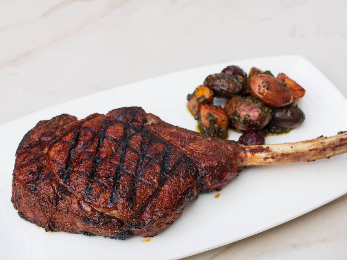 The 24-ounce chili-spiced tomahawk rib-eye steak with pesto root veggies at The Barrymore