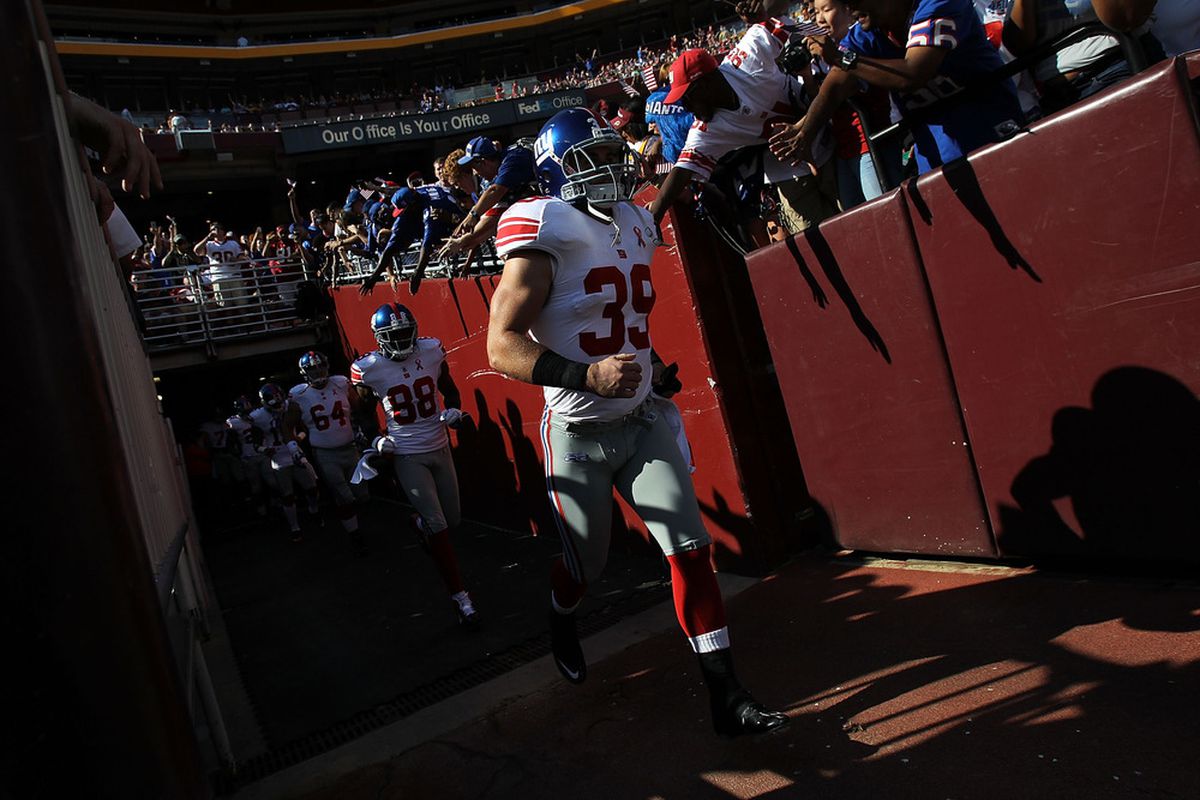 Tyler Sash (39) of the New York Giants runs onto the field before the season opener against the Washington Redskins  at FedExField on September 11, 2011 in Landover, Maryland.  (Photo by Ronald Martinez/Getty Images)
