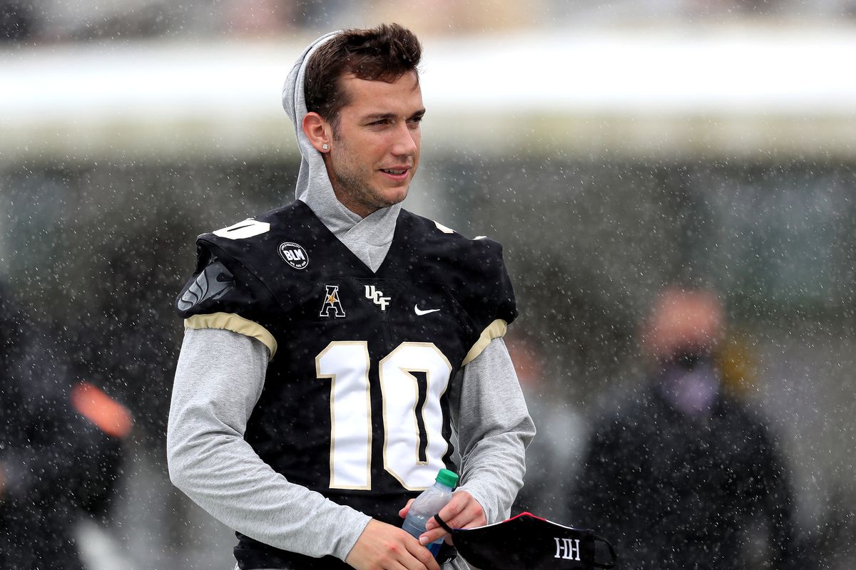 McKenzie Milton of the Central Florida Knights is seen at midfield before the game against the Cincinnati Bearcats at Bounce House-FBC Mortgage Field on November 21, 2020 in Orlando, Florida.