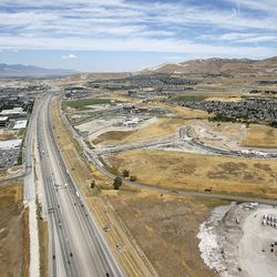 Motorists travel along I-15 in Lehi near the Point of the Mountain on Thursday, July 20, 2016.