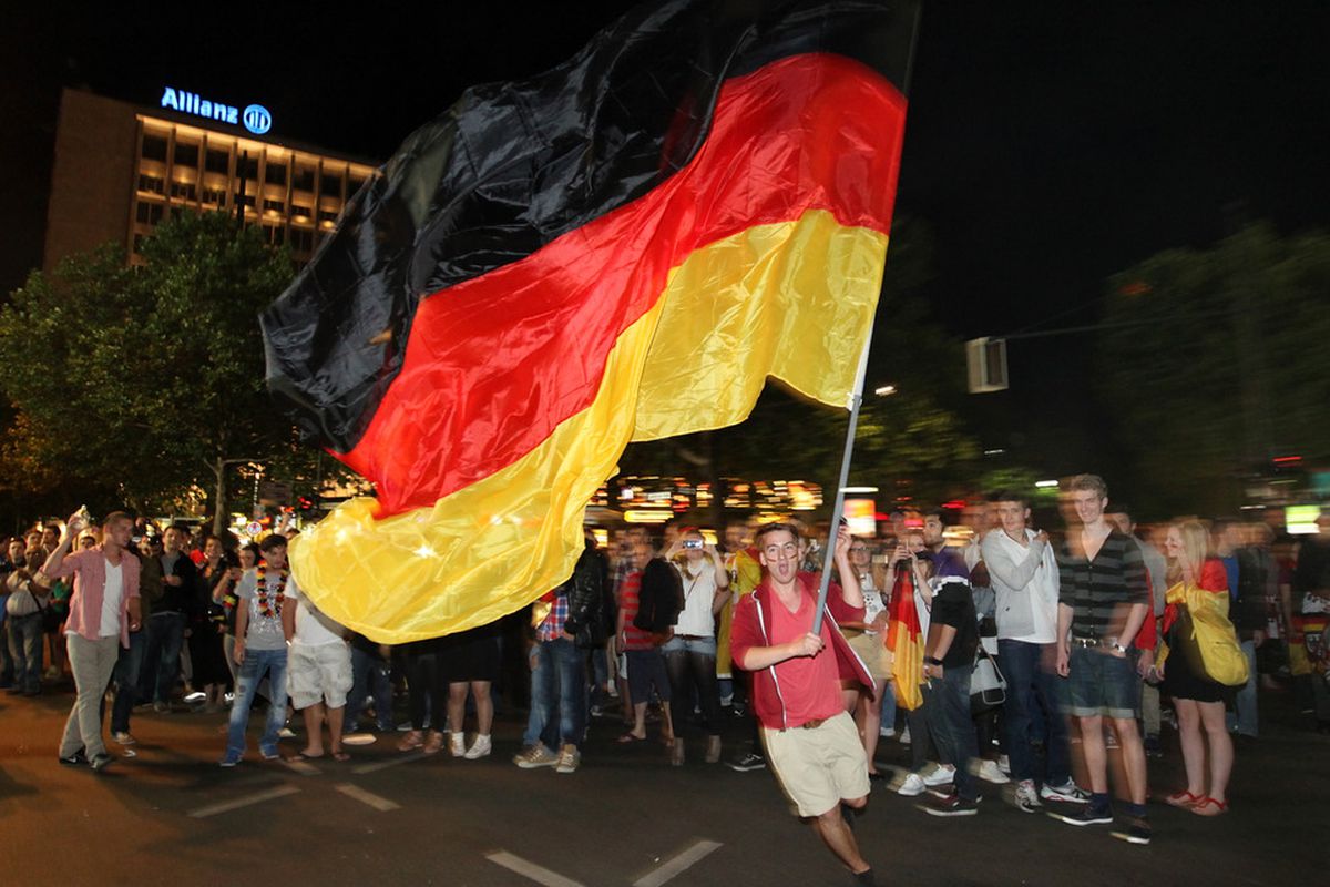 BERLIN, GERMANY - JUNE 22:  German soccer fans celebrate their team at Kurfuerstendamm after the UEFA Euro 2012 quarter final match between Germany and Greece on June 22, 2012 in Berlin, Germany.  (Photo by Matthias Kern/Getty Images,)