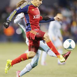 Real's Tony Beltran tries to kick the ball with Kansas City's Graham Zusi defending Saturday, Dec. 7, 2013 in MLS Cup action. Sporting KC won in a shootout.